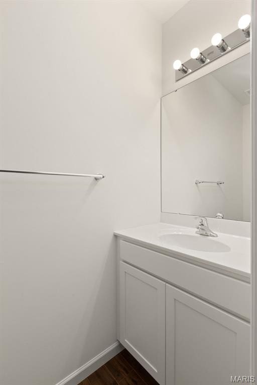 1170 Bloomfield Dr, Eureka, MO 63025 - bathroom with vanity, wood finished floors, and baseboards