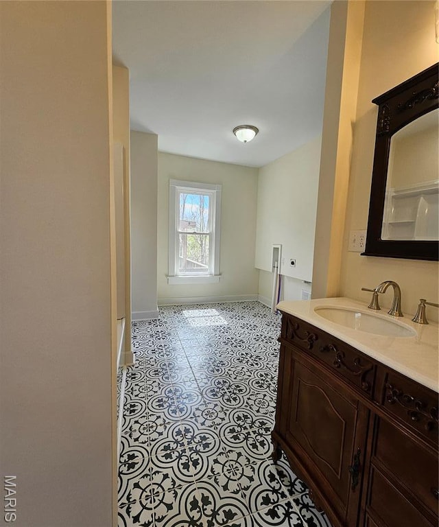bathroom with baseboards and vanity