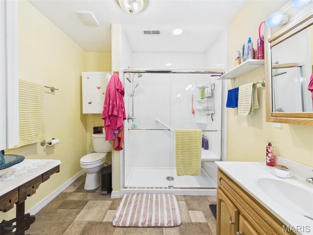 462 Harrison St, Lebanon, MO 65536 - bathroom with toilet, a shower stall, vanity, and baseboards