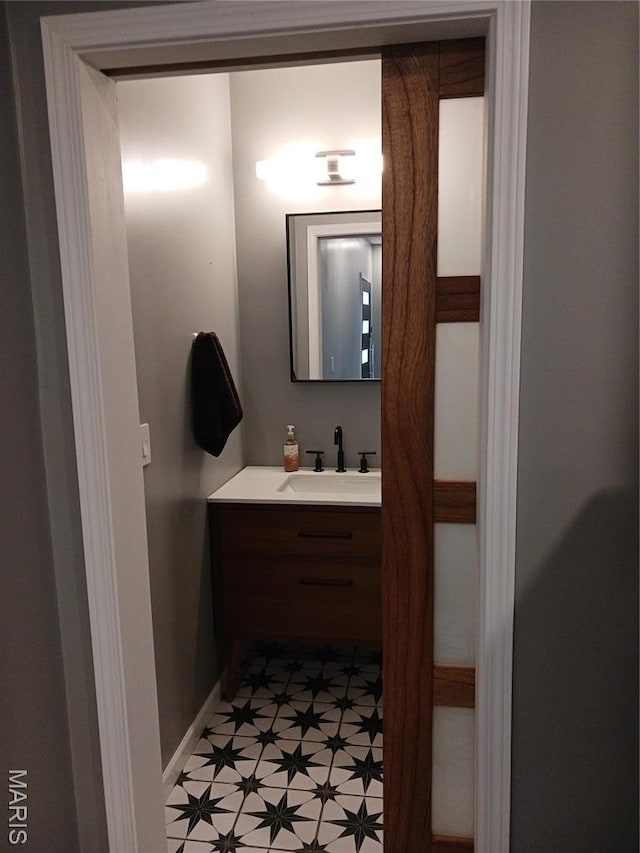 205 Lake Dr, Gray Summit, MO 63039 - bathroom with vanity, baseboards, and tile patterned floors