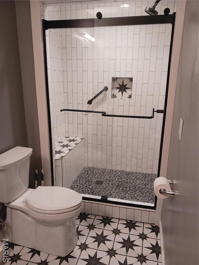 205 Lake Dr, Gray Summit, MO 63039 - full bathroom with toilet, a shower stall, and tile patterned flooring