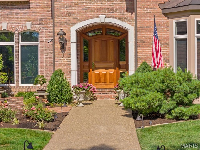 property entrance with brick siding
