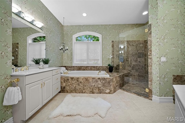 bathroom with vanity, a stall shower, a bath, recessed lighting, and tile patterned floors