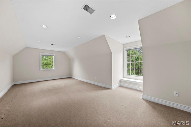 additional living space with carpet flooring, vaulted ceiling, baseboards, and recessed lighting