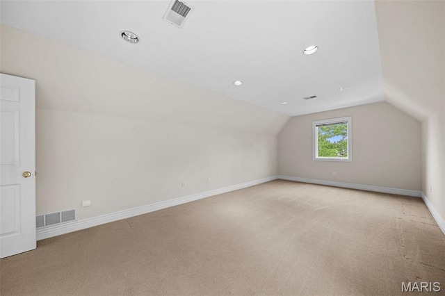 bonus room featuring light carpet, vaulted ceiling, baseboards, and recessed lighting