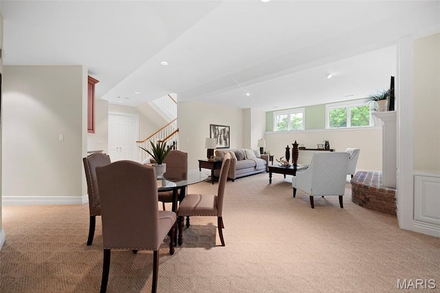 dining room with stairway, light carpet, and recessed lighting