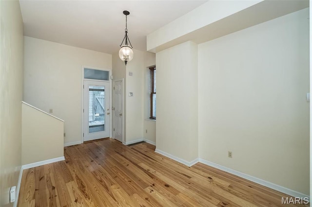 1003 Allen Ave, Saint Louis, MO 63104 - unfurnished dining area with light wood-style floors and baseboards