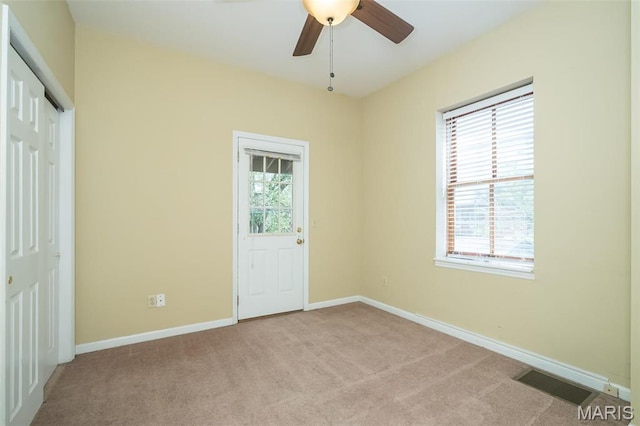 1003 Allen Ave, Saint Louis, MO 63104 - unfurnished bedroom with carpet, baseboards, and a ceiling fan