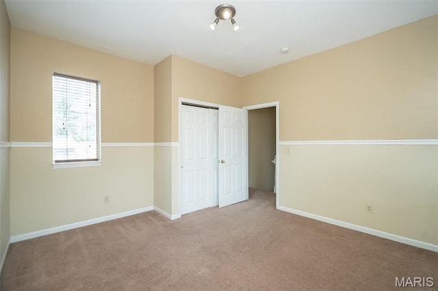 1003 Allen Ave, Saint Louis, MO 63104 - unfurnished bedroom with carpet floors, a closet, and baseboards