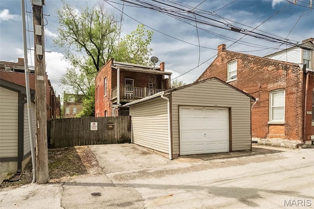 1003 Allen Ave, Saint Louis, MO 63104 - garage with fence and asphalt driveway