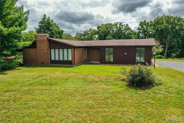 1500 Gravois Rd, High Ridge, MO 63049 - view of front of house with a chimney and a front yard