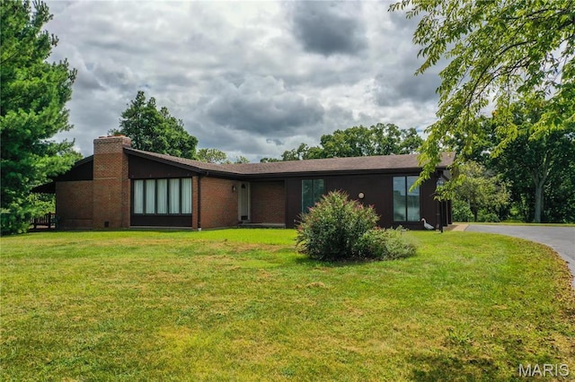 1500 Gravois Rd, High Ridge, MO 63049 - view of front facade with a chimney and a front lawn