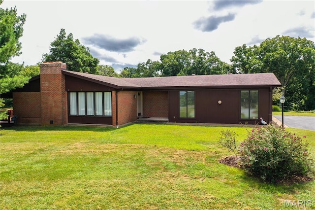 1500 Gravois Rd, High Ridge, MO 63049 - back of property featuring a chimney and a lawn