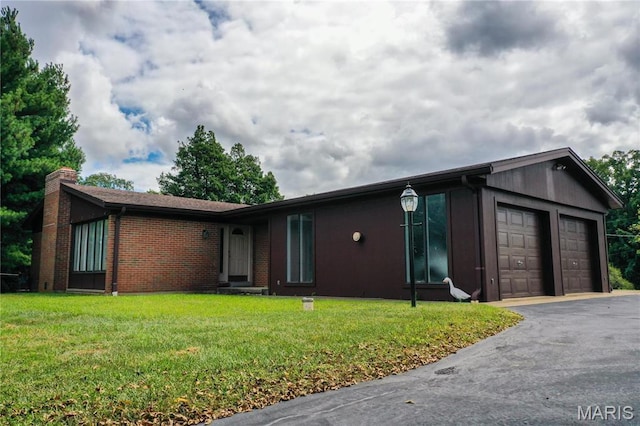 1500 Gravois Rd, High Ridge, MO 63049 - ranch-style house with a garage, a front lawn, asphalt driveway, a chimney, and brick siding