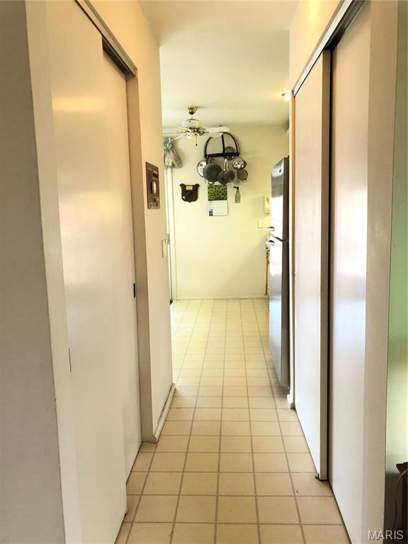 1500 Gravois Rd, High Ridge, MO 63049 - hallway with light tile patterned floors