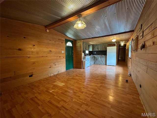 6209 Ripley 21 N-18, Doniphan, MO 63935 - unfurnished living room featuring wood walls and light wood-style floors