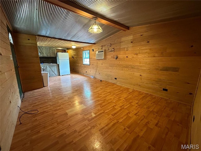 6209 Ripley 21 N-18, Doniphan, MO 63935 - spare room featuring wood walls, light wood-style flooring, and a wall mounted air conditioner