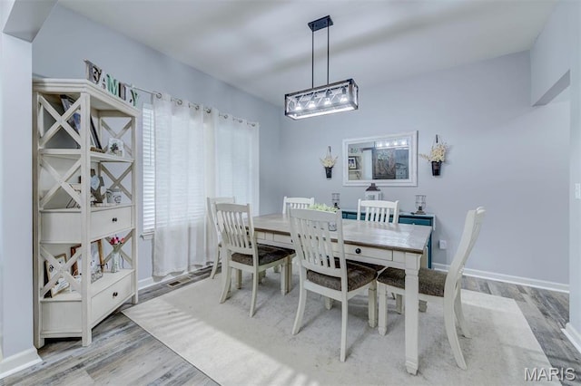 904 Indian Rock Ct, Wentzville, MO 63385 - dining room featuring wood finished floors and baseboards