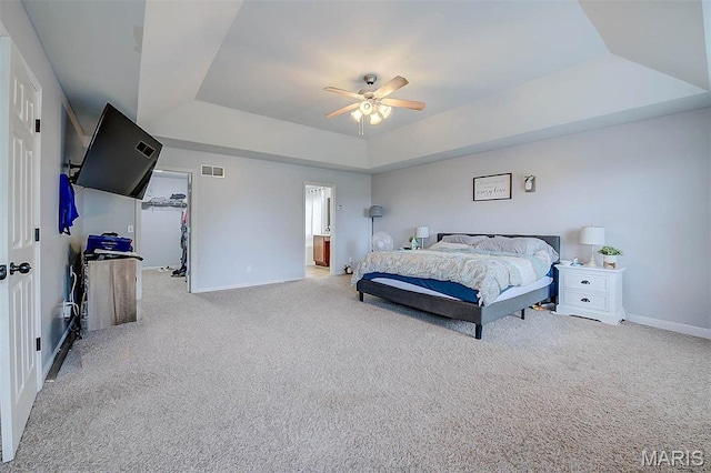 904 Indian Rock Ct, Wentzville, MO 63385 - bedroom with a raised ceiling, baseboards, carpet flooring, and a walk in closet