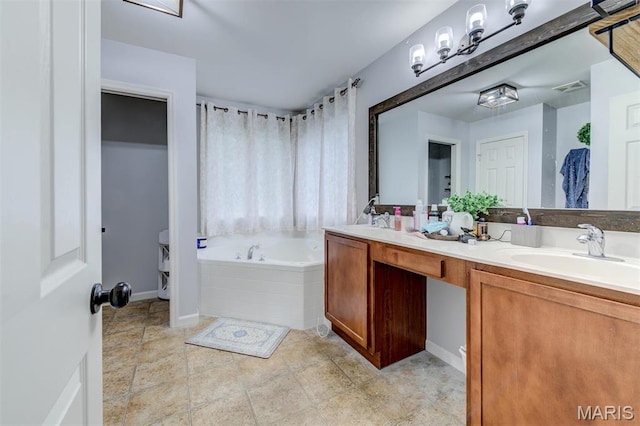 904 Indian Rock Ct, Wentzville, MO 63385 - full bathroom featuring a garden tub, double vanity, toilet, and baseboards