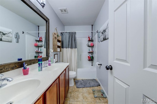 904 Indian Rock Ct, Wentzville, MO 63385 - bathroom with toilet, shower / tub combo with curtain, double vanity, baseboards, and stone finish floors