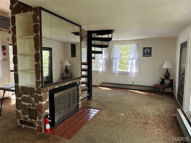 182 Ozark Dr, Ironton, MO 63650 - living room with dark carpet, baseboard heating, and a fireplace
