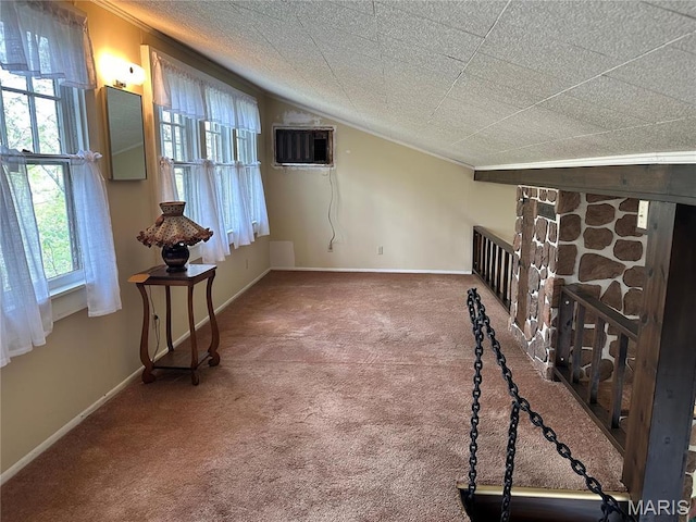 182 Ozark Dr, Ironton, MO 63650 - unfurnished living room featuring a wall mounted AC, carpet floors, ornamental molding, and baseboards