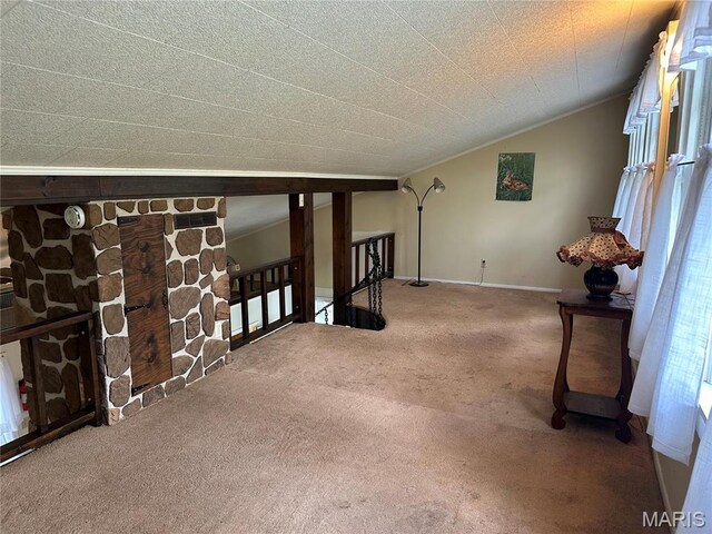 182 Ozark Dr, Ironton, MO 63650 - carpeted empty room with lofted ceiling and baseboards