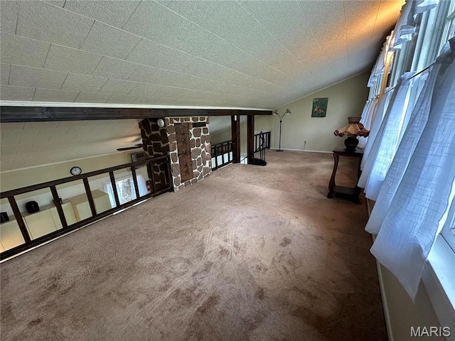 182 Ozark Dr, Ironton, MO 63650 - carpeted empty room featuring lofted ceiling and baseboards