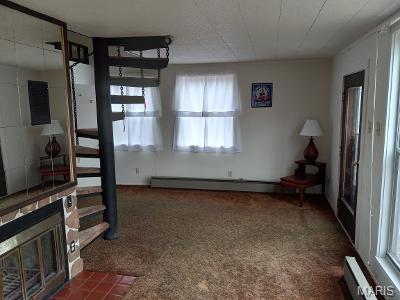 182 Ozark Dr, Ironton, MO 63650 - unfurnished living room with a fireplace, baseboard heating, and carpet floors