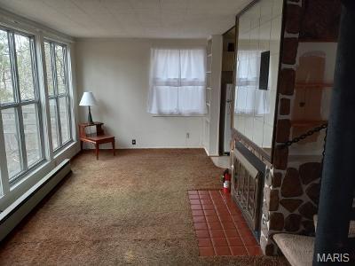 182 Ozark Dr, Ironton, MO 63650 - unfurnished sunroom featuring a baseboard radiator
