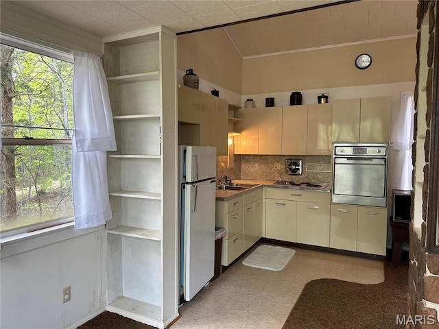 182 Ozark Dr, Ironton, MO 63650 - kitchen featuring stainless steel appliances, crown molding, open shelves, lofted ceiling, and backsplash