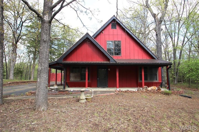 9434 Joan Ct, Bonne Terre, MO 63628 - view of front of home featuring covered porch, metal roof, and board and batten siding