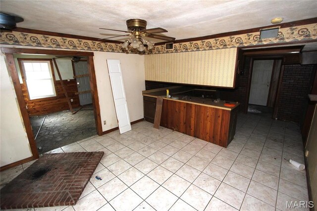 9434 Joan Ct, Bonne Terre, MO 63628 - kitchen with baseboards, a ceiling fan, and wallpapered walls