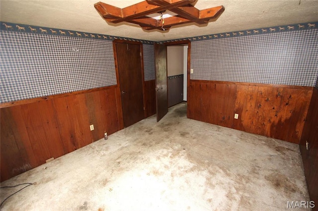9434 Joan Ct, Bonne Terre, MO 63628 - carpeted empty room with wood walls, a wainscoted wall, and a textured ceiling