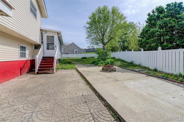 24 Shaw Ct, Cottleville Township, MO 63304 - view of patio / terrace featuring a fire pit and fence
