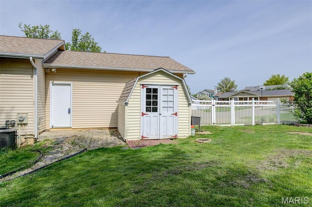 24 Shaw Ct, Cottleville Township, MO 63304 - rear view of property with a storage shed, an outdoor structure, and central air condition unit