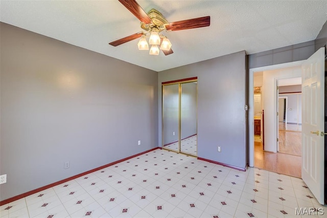 24 Shaw Ct, Cottleville Township, MO 63304 - unfurnished bedroom with baseboards, a closet, and a ceiling fan