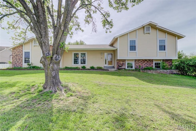 24 Shaw Ct, Cottleville Township, MO 63304 - tri-level home featuring a front yard