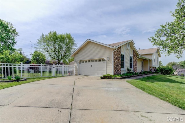 24 Shaw Ct, Cottleville Township, MO 63304 - view of property exterior featuring a garage, driveway, and stone siding