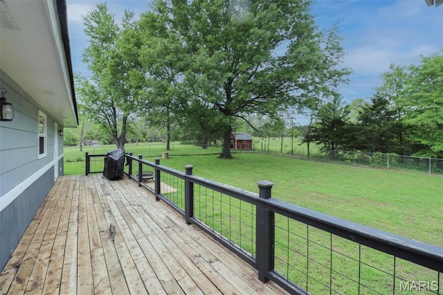 wooden terrace with an outdoor structure and a shed