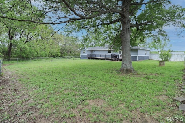 view of yard featuring a wooden deck
