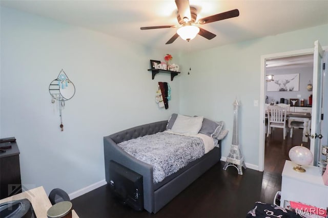 bedroom with wood finished floors, baseboards, and ceiling fan