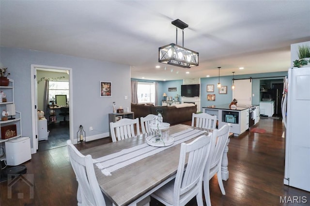 dining room featuring recessed lighting and dark wood finished floors