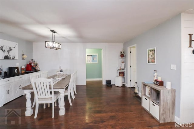 dining room featuring dark wood-type flooring