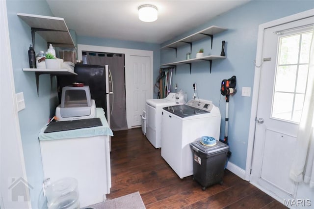washroom featuring separate washer and dryer and dark wood-style floors