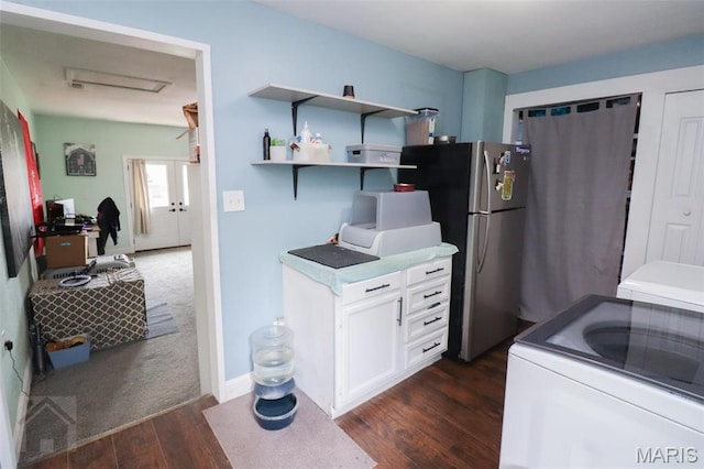 kitchen featuring freestanding refrigerator, dark wood finished floors, a desk, white cabinetry, and open shelves