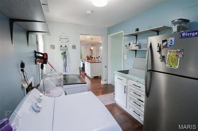 kitchen with freestanding refrigerator, dark wood-style flooring, white cabinetry, open shelves, and separate washer and dryer