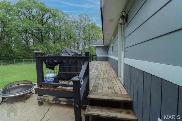 exterior view of fence and a fire pit