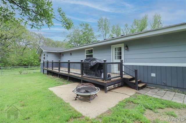 rear view of house featuring an outdoor fire pit, a deck, and a patio area